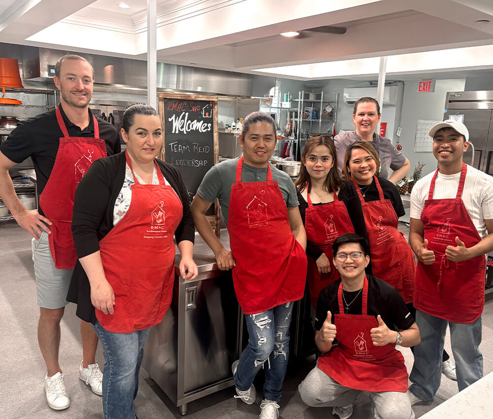 Volunteers gather for a photo in the kitchen