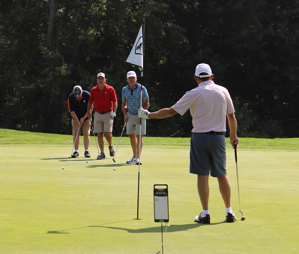 Golfer lining up putts during a event