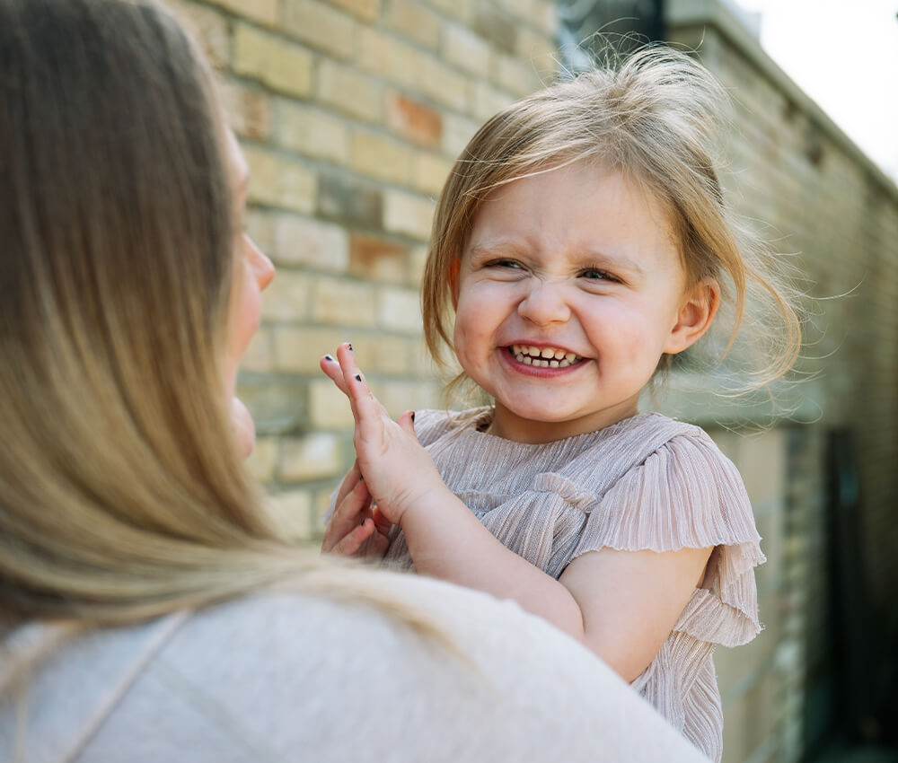 Child smiles for photograph