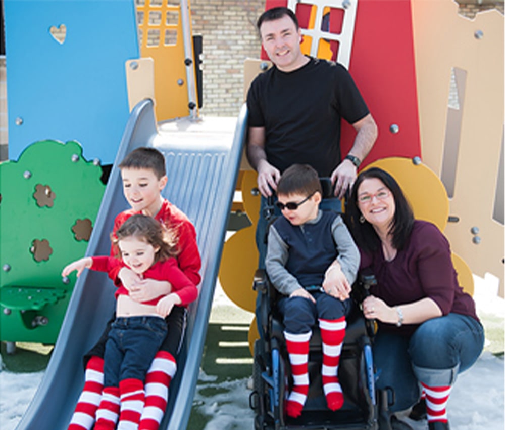Family enjoy outdoor playground fun