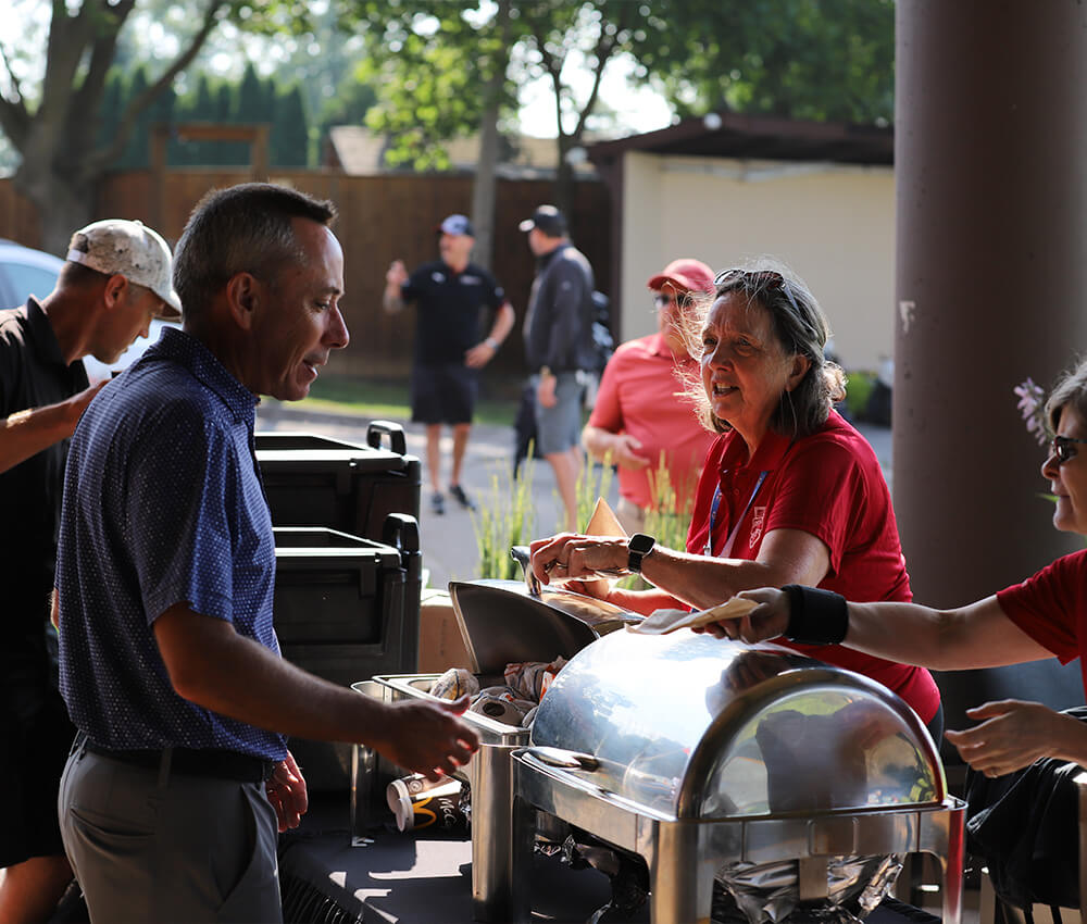Event team serve breakfast to event participants