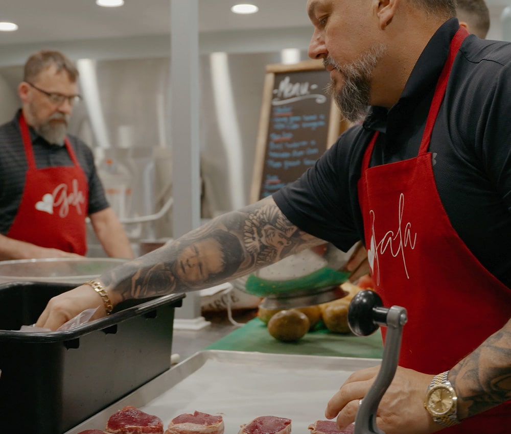 Workplace volunteers preparing meals in the kitchen